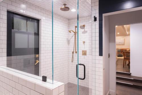 a bathroom with a shower with a glass door at Channel Islands Beach Retreat in Oxnard