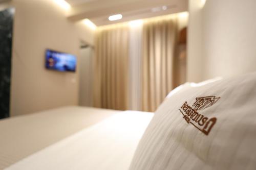 a close up of a bed in a hotel room at Beratinus1 in Berat