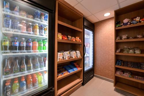 a refrigerator filled with lots of different types of drinks at Fairfield Inn & Suites by Marriott Pittsburgh New Stanton in New Stanton