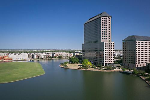 a view of a city with a river and buildings at Marriott Dallas Las Colinas in Irving