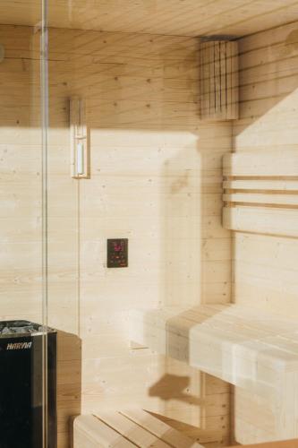 a sauna with stairs in a wooden wall at Ferienwohnung Alpenblick I Kamin I private Sauna in Wangen im Allgäu