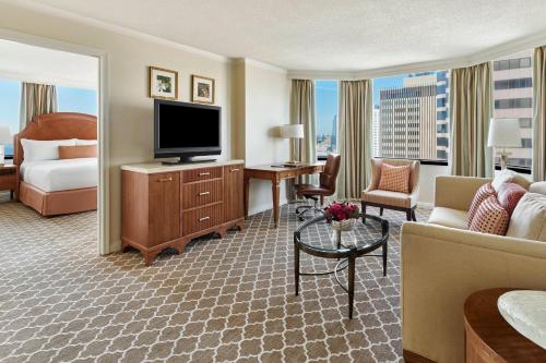 a hotel room with a bed and a television at The Whitley, a Luxury Collection Hotel, Atlanta Buckhead in Atlanta