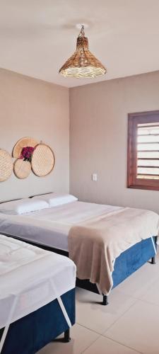 Postel nebo postele na pokoji v ubytování Chalé Sol de Macapá 2 - Sua Casa pertinho do Mar