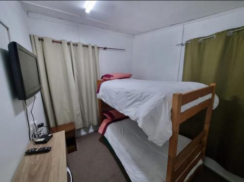 TV a/nebo společenská místnost v ubytování Hospedaje Residencial Atenas