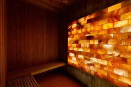 a corner of a sauna with a brick wall at Al Wathba, a Luxury Collection Desert Resort & Spa, Abu Dhabi in Abu Dhabi