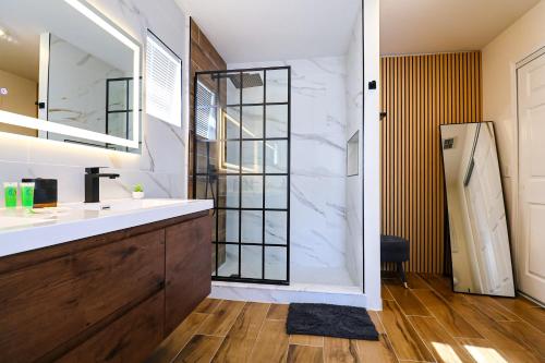 a bathroom with a sink and a shower at New APT 15Min Drive Disney and Airport - Parks KingBed Pets in Kissimmee