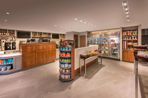 a grocery store aisle with a counter and a pharmacy at Denver Marriott Tech Center in Greenwood Village