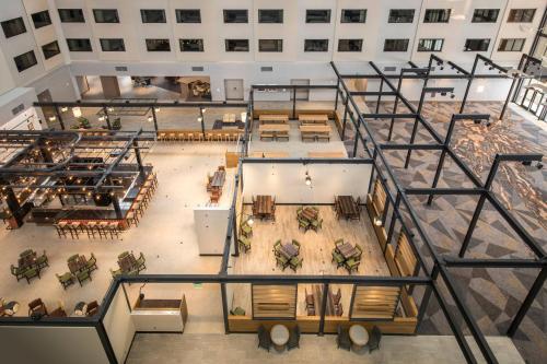 an overhead view of a large building with tables and chairs at Denver Marriott Tech Center in Greenwood Village