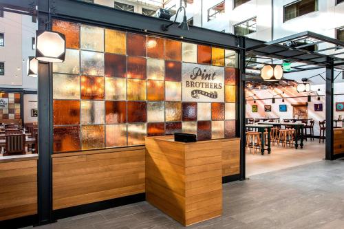 a restaurant with a wall of stained glass at Denver Marriott Tech Center in Greenwood Village