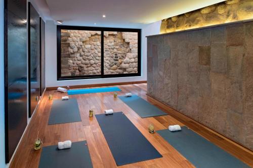 a yoga room with a bunch of yoga mats at JW Marriott El Convento Cusco in Cusco