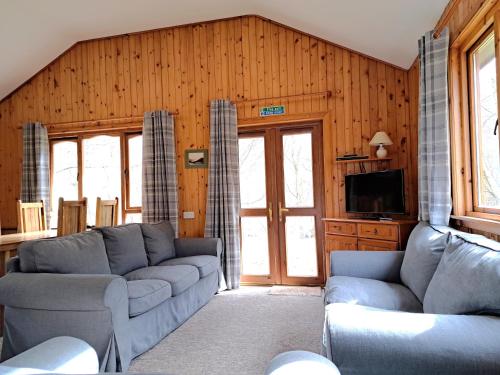 Χώρος καθιστικού στο Plodda Lodge at Lochletter Lodges