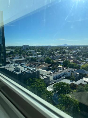 a view of a city from a window at Hotel Aranjuez in Chillán