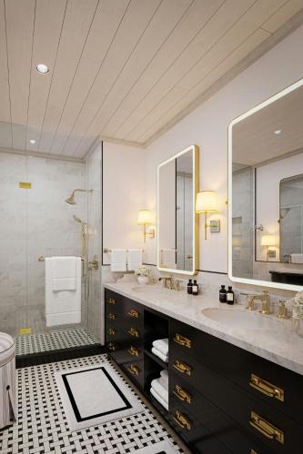 a bathroom with two sinks and a shower at Colony Club, a Luxury Collection Resort, Barbados in Saint James