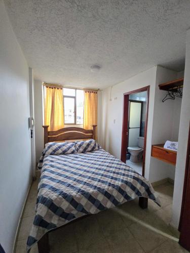Un pat sau paturi într-o cameră la Hotel Class