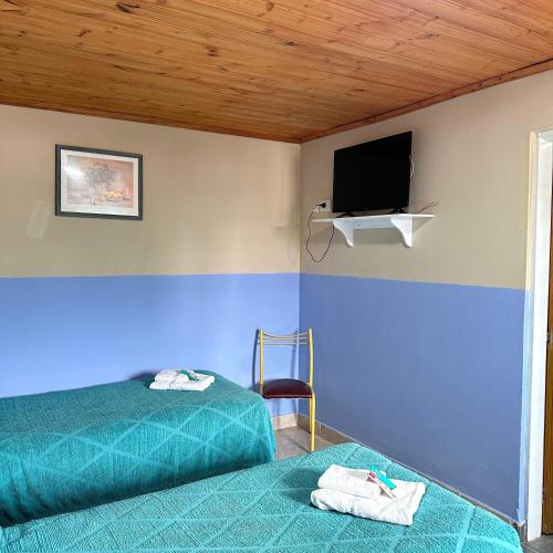 Postel nebo postele na pokoji v ubytování Hosteria Los 2 Pinos