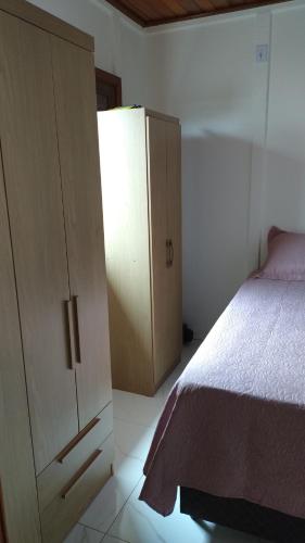 Кровать или кровати в номере Casa pé na areia