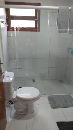 Ванная комната в Casa pé na areia