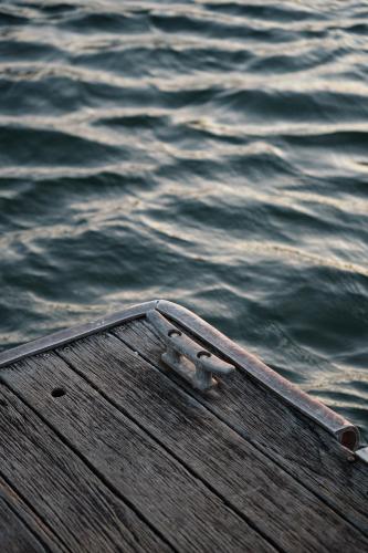 a metal object sitting on a dock near the water at Culburra Beach Motel in Culburra Beach