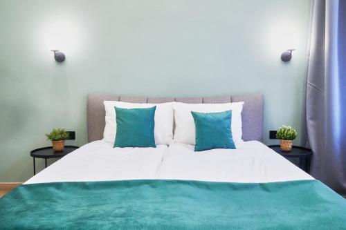 Posteľ alebo postele v izbe v ubytovaní NAVI Residence Erzsebet