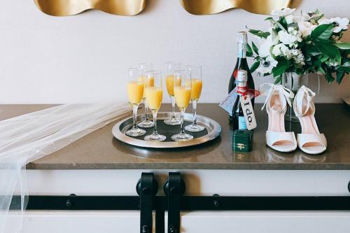 a tray with champagne glasses and a bottle of wine at Des Moines Marriott Downtown in Des Moines