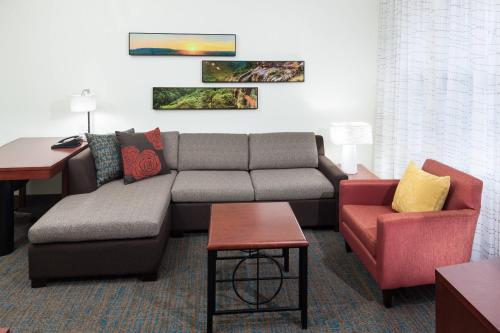 a living room with a couch and a chair at Residence Inn by Marriott Franklin Cool Springs in Franklin
