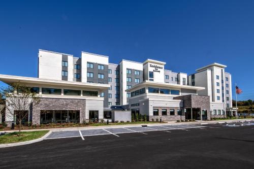 a parking lot in front of a large building at Residence Inn by Marriott Nashville at Opryland in Nashville
