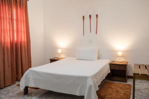 Postel nebo postele na pokoji v ubytování Hotel Praia