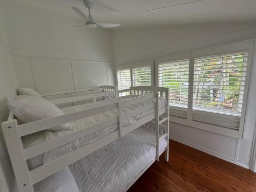 Ένα ή περισσότερα κρεβάτια σε δωμάτιο στο K'Gari House Eurong