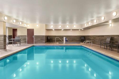 a pool with blue water in a hotel room at Fairfield Inn by Marriott Visalia Sequoia in Visalia