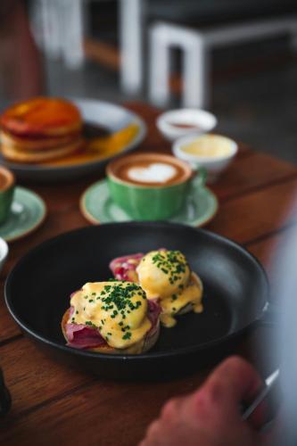 a plate of food on a table with pancakes at JW Marriott Marquis Hotel Dubai in Dubai