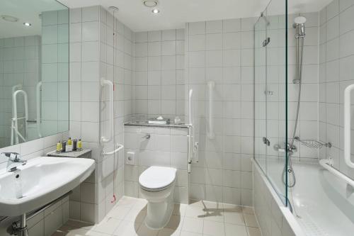 a bathroom with a toilet and a sink and a shower at Leicester Marriott Hotel in Leicester