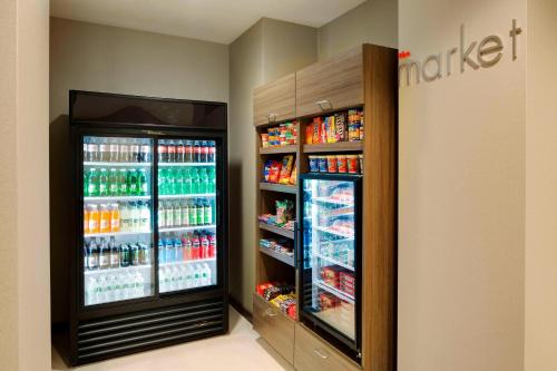 a drink refrigerator in a store with drinks at Residence Inn by Marriott Bangor in Bangor