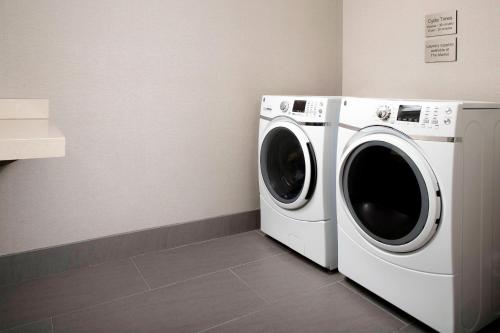 a washer and dryer in a laundry room at Fairfield Inn & Suites by Marriott Alexandria West/Mark Center in Alexandria