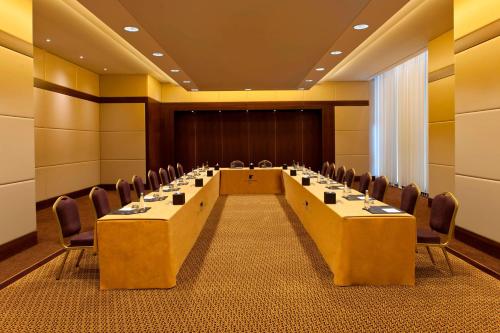 a conference room with a long table and chairs at JW Marriott Hotel Ankara in Ankara
