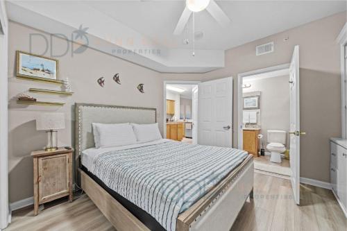 a bedroom with a bed and a bathroom at Legacy Tower I 302 in Gulfport