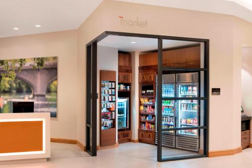 a store with an open door to a refrigerator at Residence Inn by Marriott Boston Watertown in Watertown