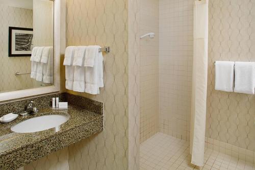 a bathroom with a sink and a shower at Residence Inn Worcester in Worcester