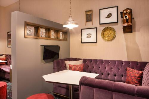 a living room with a couch and a table at Residence Inn by Marriott Boston Braintree in Braintree