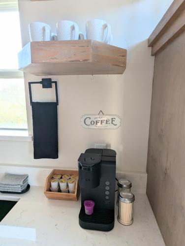 a coffee maker sitting on a counter in a kitchen at Luxury Cabin in The Country With King Bed and Loft #1 in Point