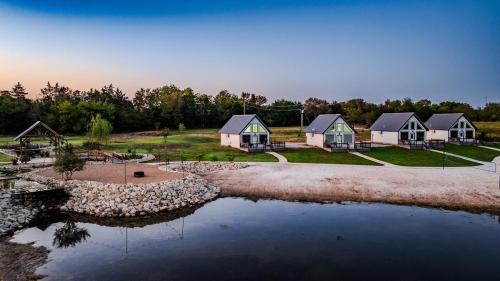 an aerial view of a group of houses next to a river at Luxury Cabin in The Country With King Bed and Loft #1 in Point