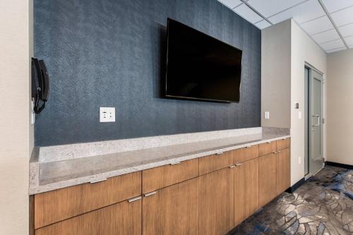 a flat screen tv on a wall in a room at Fairfield Inn & Suites by Marriott Crestview in Crestview