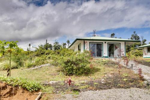 a house sitting on top of a hill at Cozy Space - 1 Mi to Ocean! in Keaau