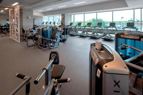 a gym with rows of treadmills and machines at Philadelphia Airport Marriott in Philadelphia