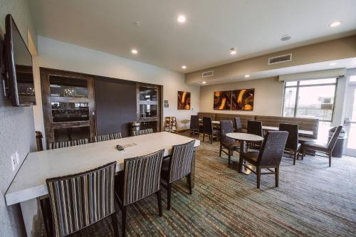 a dining room with a large table and chairs at Residence Inn by Marriott Harlingen in Harlingen