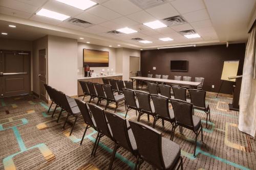 a conference room with chairs and a bar at Residence Inn by Marriott Harlingen in Harlingen