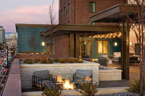 a patio with a fire pit in front of a building at Residence Inn by Marriott Boise Downtown City Center in Boise