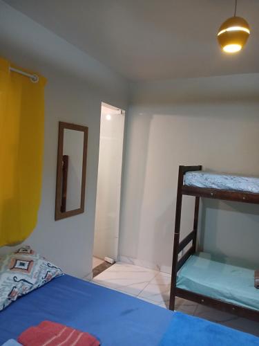 Cama o camas de una habitación en Hospedagem Brilho do Sol