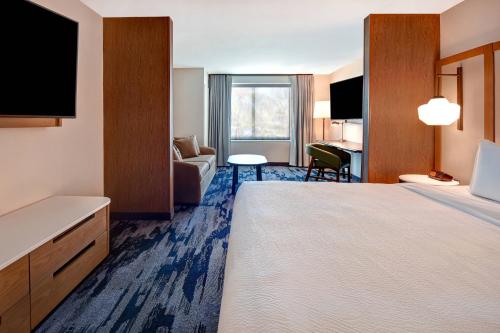 a hotel room with a large bed and a television at Fairfield Inn & Suites Las Vegas Airport South in Las Vegas