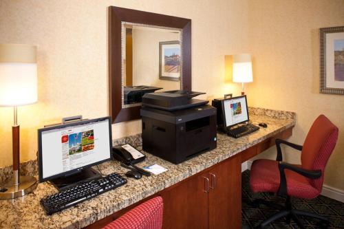 a hotel room with a desk with a computer on it at Residence Inn Arundel Mills BWI Airport in Hanover