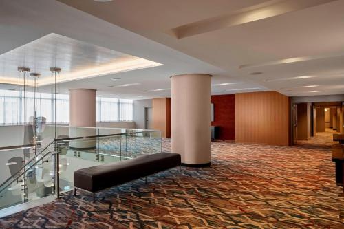 a lobby with a glass staircase in a building at Residence Inn by Marriott Baltimore at The Johns Hopkins Medical Campus in Baltimore